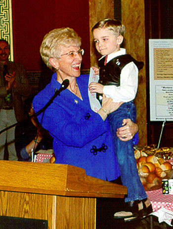 Governor Judy Martz holds Seth Robertus during the 2001 Agricultural Appreciation Legislative Luncheon